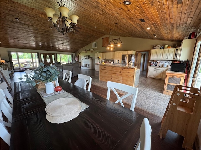 6414 300th Rd, Martinsville, IL 62442 - dining area featuring a chandelier, wood ceiling, and high vaulted ceiling