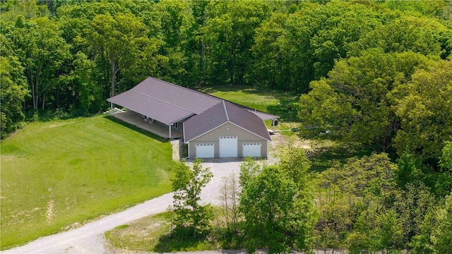 view of subject property with a forest