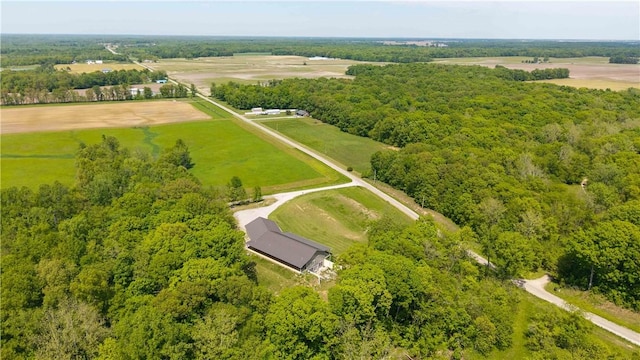 view of rural area featuring a heavily wooded area