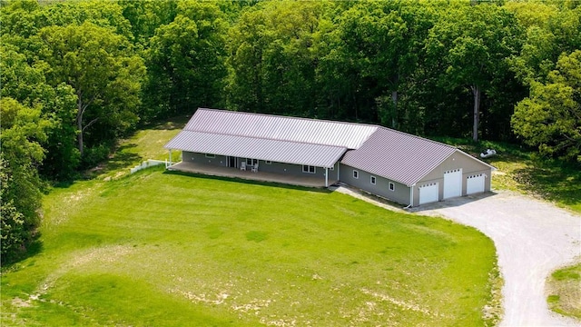 view of subject property featuring a forest