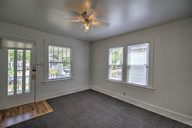 1263 E Dickinson Ave, Decatur, IL 62521 - entryway with a ceiling fan and dark carpet