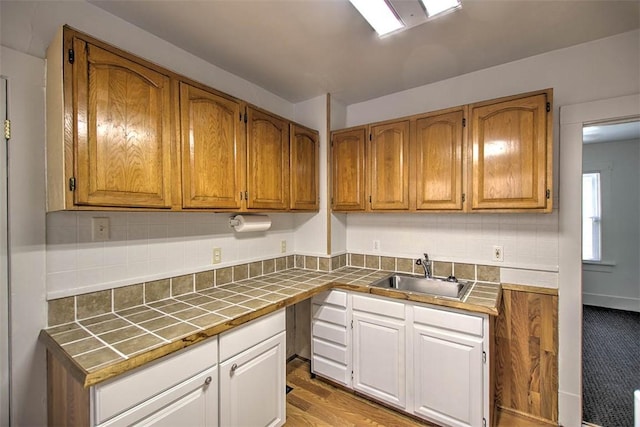 1263 E Dickinson Ave, Decatur, IL 62521 - kitchen featuring tile countertops, backsplash, and brown cabinets