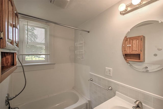 1263 E Dickinson Ave, Decatur, IL 62521 - bathroom featuring shower / tub combination, a wainscoted wall, and vanity