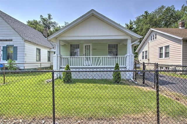 1263 E Dickinson Ave, Decatur, IL 62521 - shotgun-style home with a porch and a gate