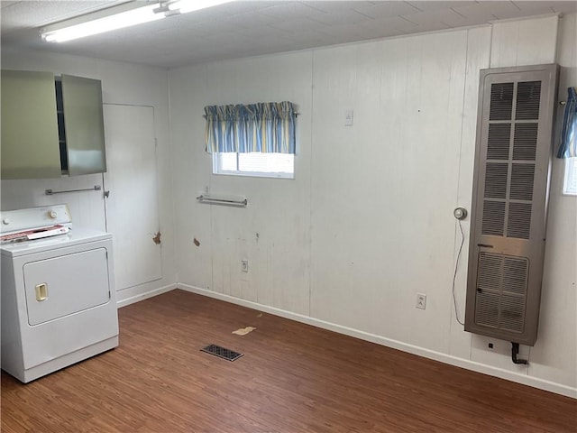 laundry room with washer / dryer and wood-type flooring