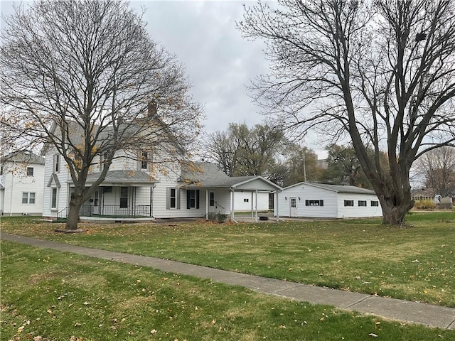 view of front of home with covered porch and a front yard