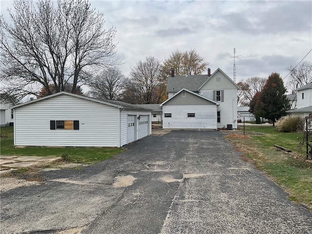 view of side of home featuring a garage