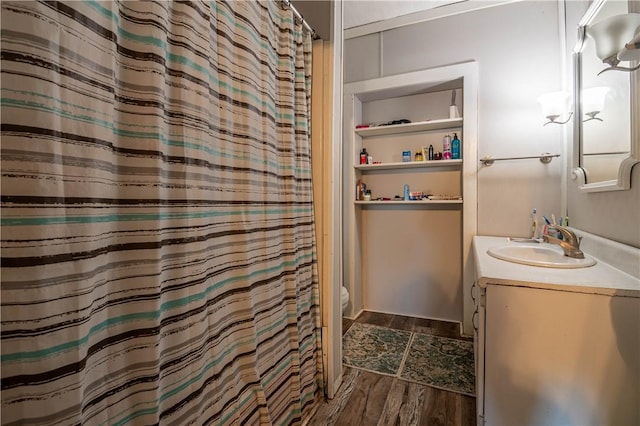 full bathroom featuring vanity, toilet, a shower with curtain, and wood finished floors