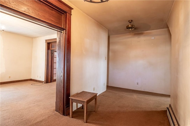 hallway featuring carpet flooring and a baseboard radiator