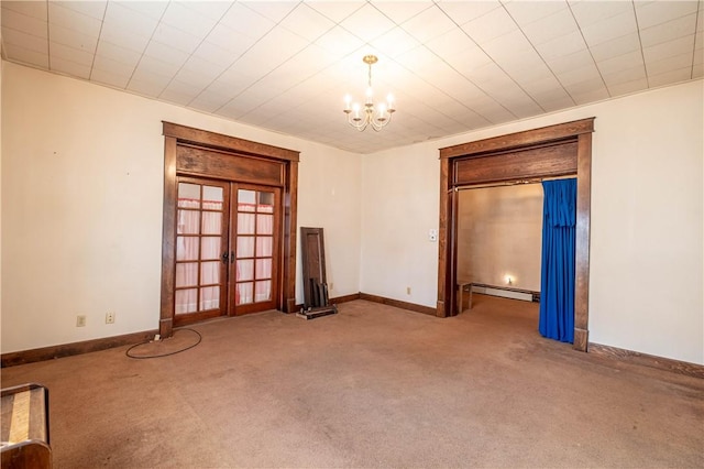 carpeted empty room featuring a notable chandelier, french doors, baseboards, and a baseboard radiator