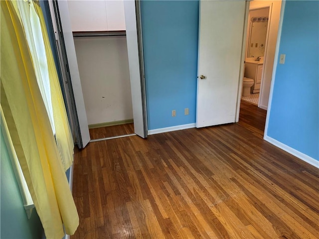 824 Kenton Dr, Charleston, IL 61920 - unfurnished bedroom featuring wood finished floors and a closet