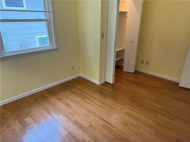 824 Kenton Dr, Charleston, IL 61920 - unfurnished bedroom with light wood-style floors and baseboards
