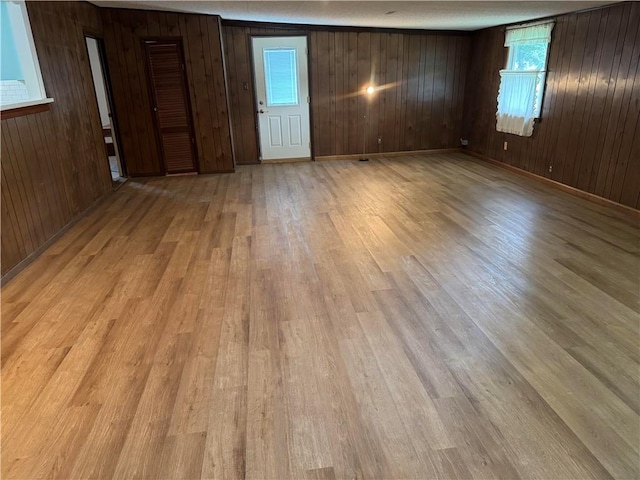 824 Kenton Dr, Charleston, IL 61920 - empty room with light wood-style floors and wood walls