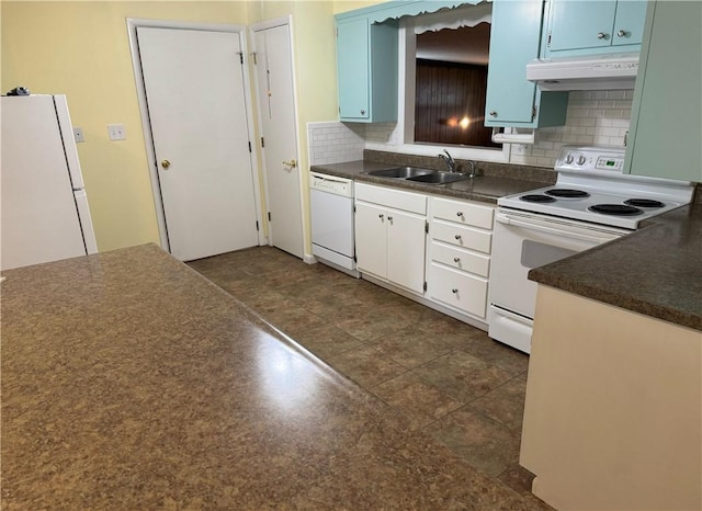 824 Kenton Dr, Charleston, IL 61920 - kitchen with white appliances, under cabinet range hood, dark countertops, decorative backsplash, and blue cabinetry