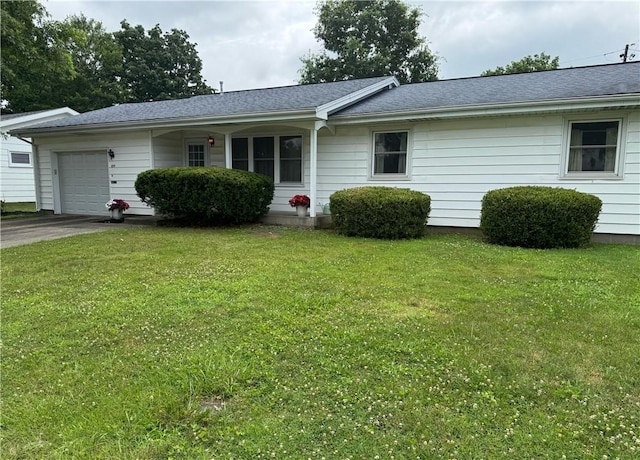 824 Kenton Dr, Charleston, IL 61920 - single story home with an attached garage, a front lawn, driveway, and a shingled roof
