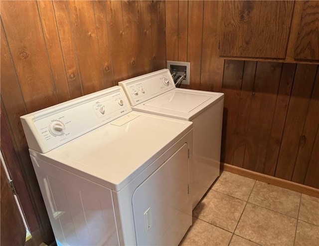 824 Kenton Dr, Charleston, IL 61920 - laundry room with washer and clothes dryer, wood walls, and light tile patterned flooring
