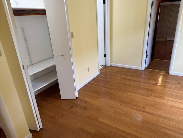824 Kenton Dr, Charleston, IL 61920 - unfurnished bedroom featuring wood finished floors and baseboards