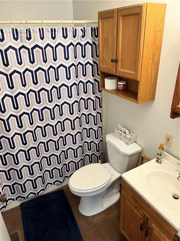 1021 W Hayes Ave, Charleston, IL 61920 - bathroom with vanity, a shower with shower curtain, and tile patterned floors