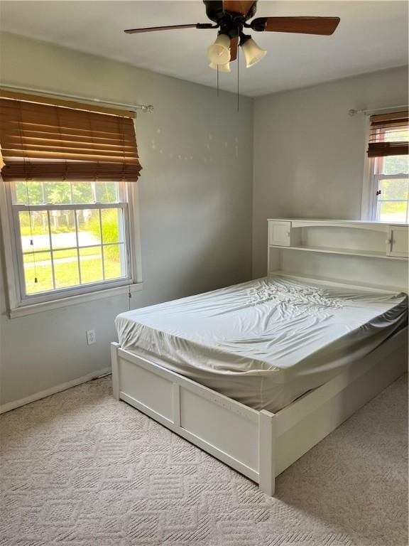 1021 W Hayes Ave, Charleston, IL 61920 - carpeted bedroom with ceiling fan and baseboards