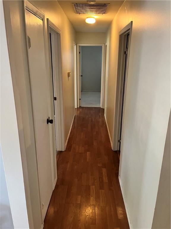 1021 W Hayes Ave, Charleston, IL 61920 - corridor with dark wood finished floors and baseboards