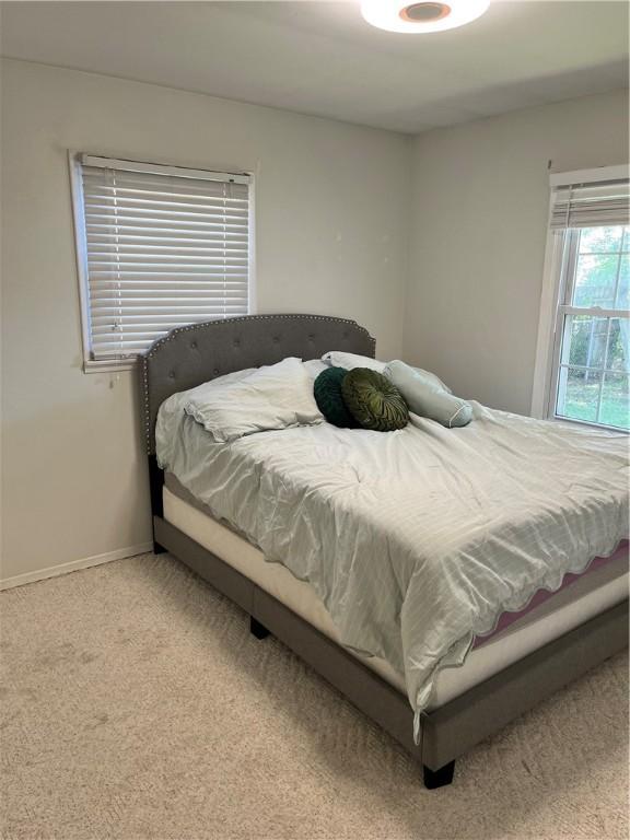 1021 W Hayes Ave, Charleston, IL 61920 - bedroom with baseboards and carpet