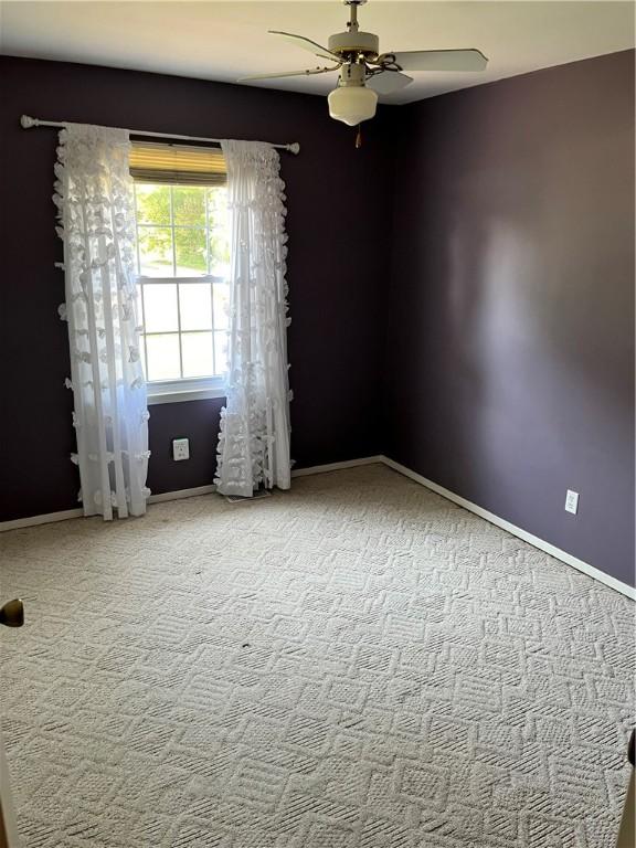 1021 W Hayes Ave, Charleston, IL 61920 - carpeted spare room featuring ceiling fan and baseboards