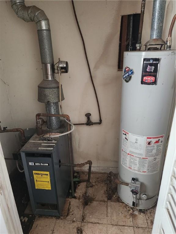 utility room with gas water heater