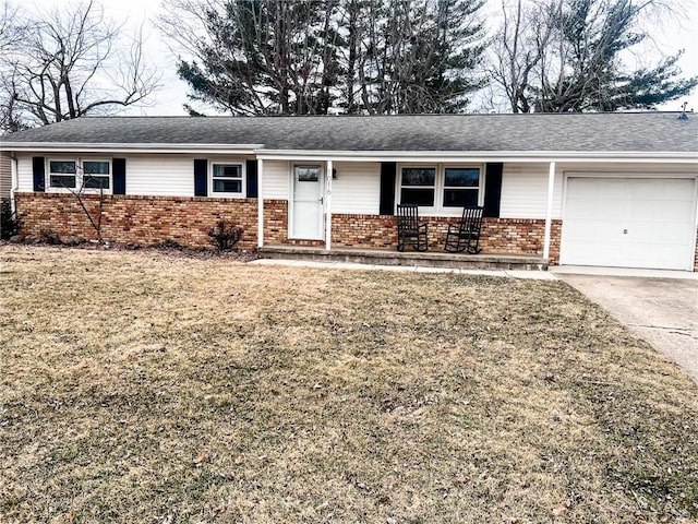 ranch-style house featuring a garage, concrete driveway, a front lawn, a porch, and brick siding