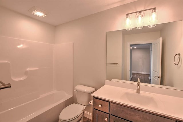 full bathroom featuring shower / tub combination, vanity, and toilet