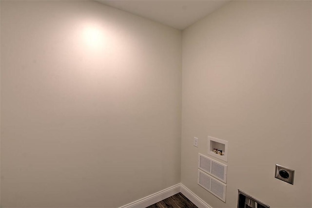 clothes washing area with dark hardwood / wood-style floors, electric dryer hookup, and hookup for a washing machine