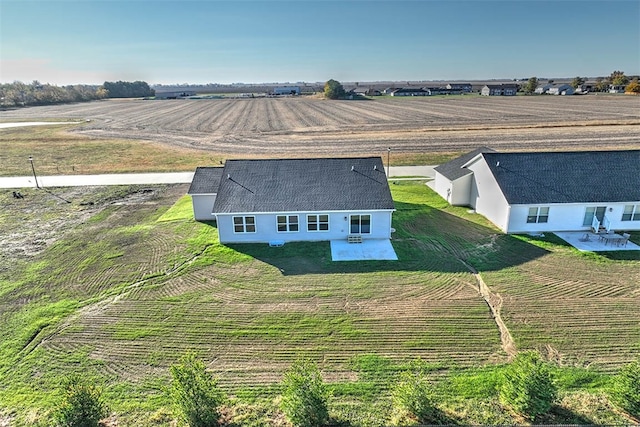 birds eye view of property with a rural view