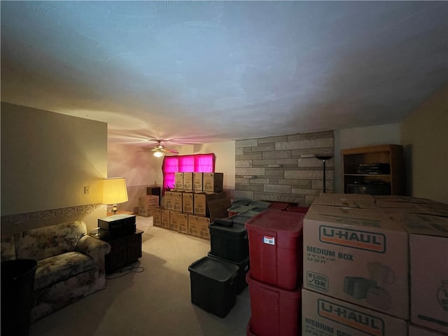 interior space featuring ceiling fan and light colored carpet