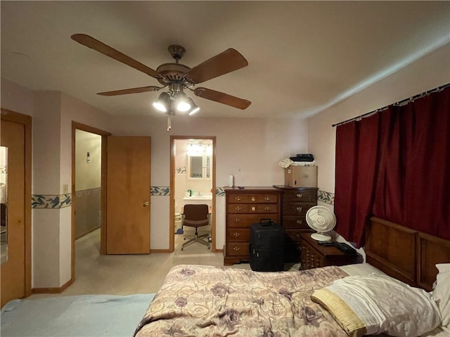 carpeted bedroom featuring connected bathroom and ceiling fan