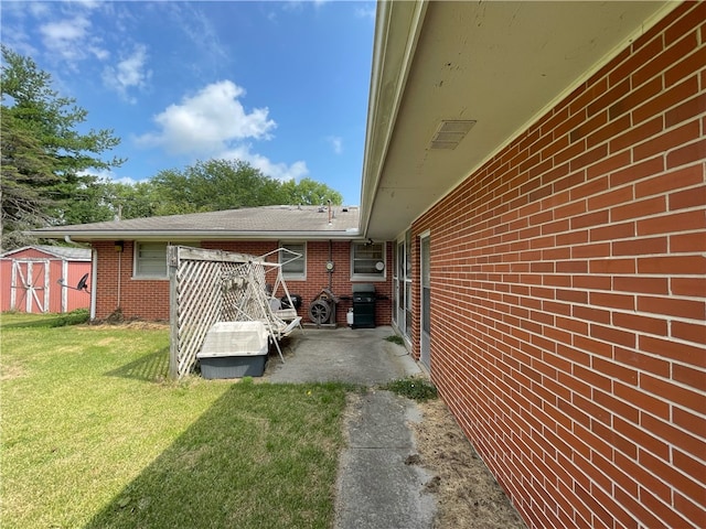 view of side of home featuring a lawn