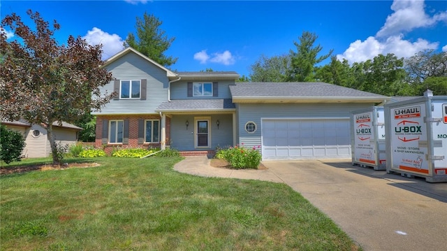 162 S Hillcrest Blvd, Decatur, IL 62522 - traditional-style home featuring a garage, a front yard, driveway, and brick siding