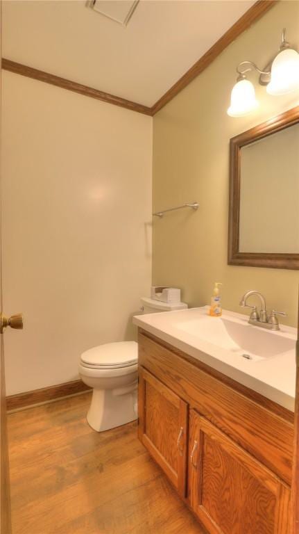 162 S Hillcrest Blvd, Decatur, IL 62522 - bathroom featuring ornamental molding, vanity, and wood finished floors