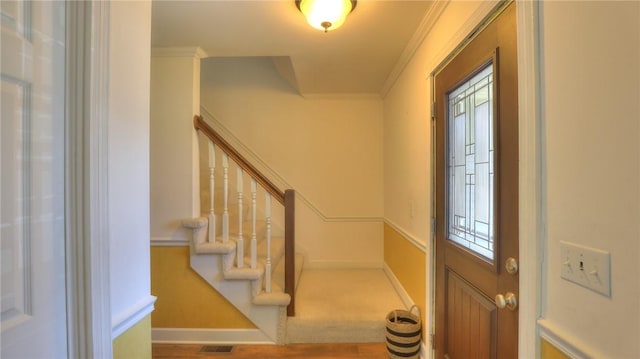 162 S Hillcrest Blvd, Decatur, IL 62522 - foyer entrance featuring crown molding, stairway, and wood finished floors