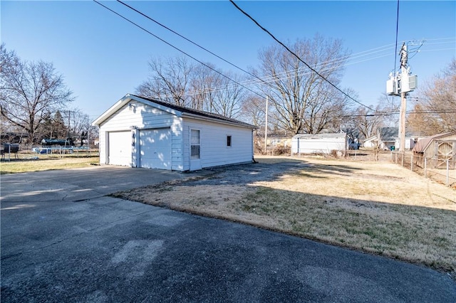 detached garage with fence