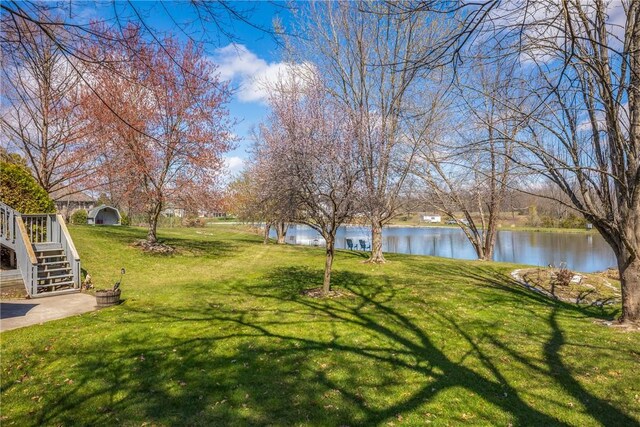11284 E Lincolnshire Ln, Effingham, IL 62401 - view of green lawn with a water view and stairway