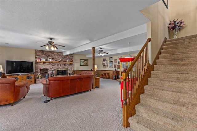 11284 E Lincolnshire Ln, Effingham, IL 62401 - living area with ceiling fan, carpet, stairway, a fireplace, and wainscoting