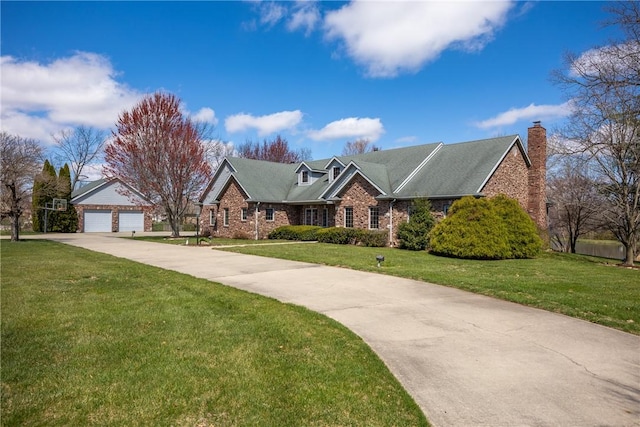 11284 E Lincolnshire Ln, Effingham, IL 62401 - view of front of property featuring a front lawn, a detached garage, a chimney, and brick siding