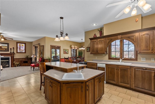 11284 E Lincolnshire Ln, Effingham, IL 62401 - kitchen featuring a ceiling fan, a sink, a kitchen island with sink, open floor plan, and light countertops