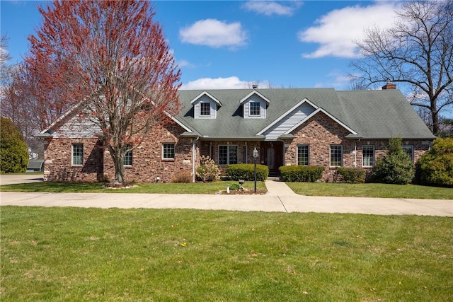 11284 E Lincolnshire Ln, Effingham, IL 62401 - cape cod home with a front lawn and brick siding