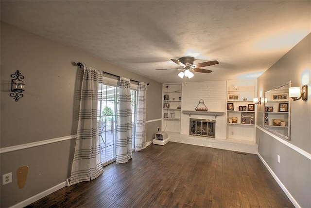 8070 Cerro Gordo Blacktop, Oakley, IL 62501 - unfurnished living room with a glass covered fireplace, baseboards, ceiling fan, and dark wood-style flooring