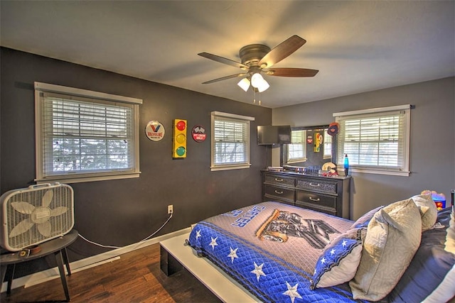 8070 Cerro Gordo Blacktop, Oakley, IL 62501 - bedroom featuring wood finished floors, a ceiling fan, and baseboards