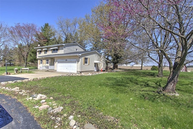 8070 Cerro Gordo Blacktop, Oakley, IL 62501 - view of home's exterior featuring a lawn, driveway, and a garage