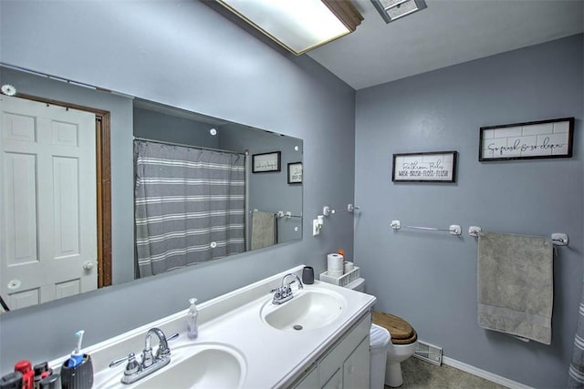 8070 Cerro Gordo Blacktop, Oakley, IL 62501 - full bath with visible vents, a sink, double vanity, and toilet