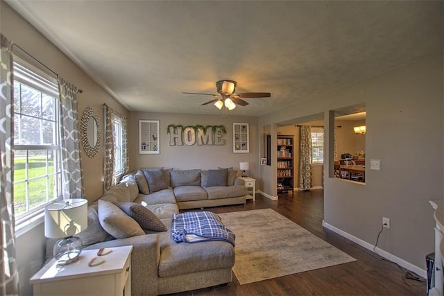 8070 Cerro Gordo Blacktop, Oakley, IL 62501 - living area featuring baseboards, ceiling fan, and dark wood-style floors