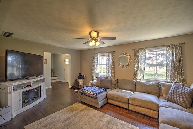8070 Cerro Gordo Blacktop, Oakley, IL 62501 - living area featuring ceiling fan, baseboards, wood finished floors, and visible vents