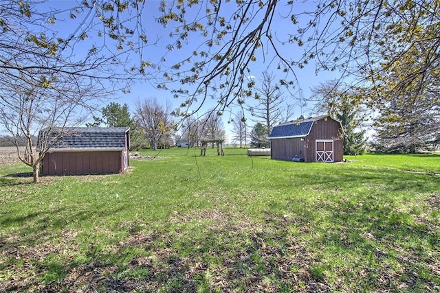 8070 Cerro Gordo Blacktop, Oakley, IL 62501 - view of yard featuring a storage unit, an outdoor structure, and a barn